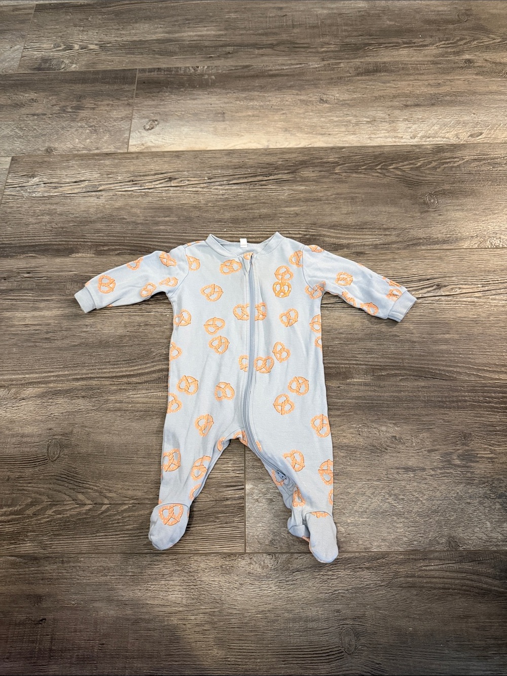 Pekkle Light Blue Footed Baby One-Piece with Orange Pretzel Print